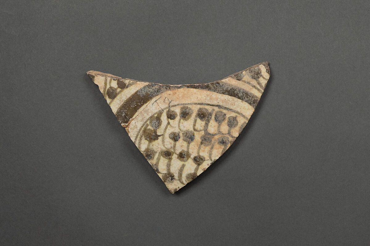 Fragment of a Bowl, Earthenware; white slip, greenish-black slip decoration, imitation luster underglaze, glazed 