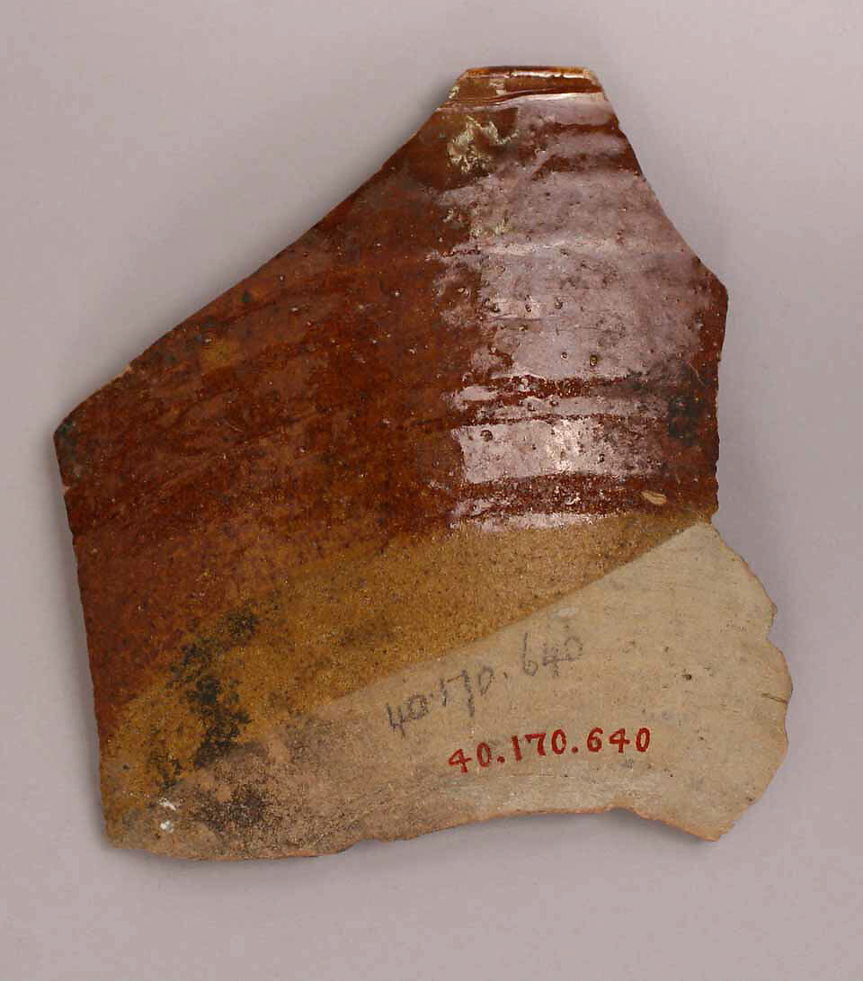 Fragment of a Bowl, Earthenware; gritty buff body, yellow and red-brown decoration, glazed