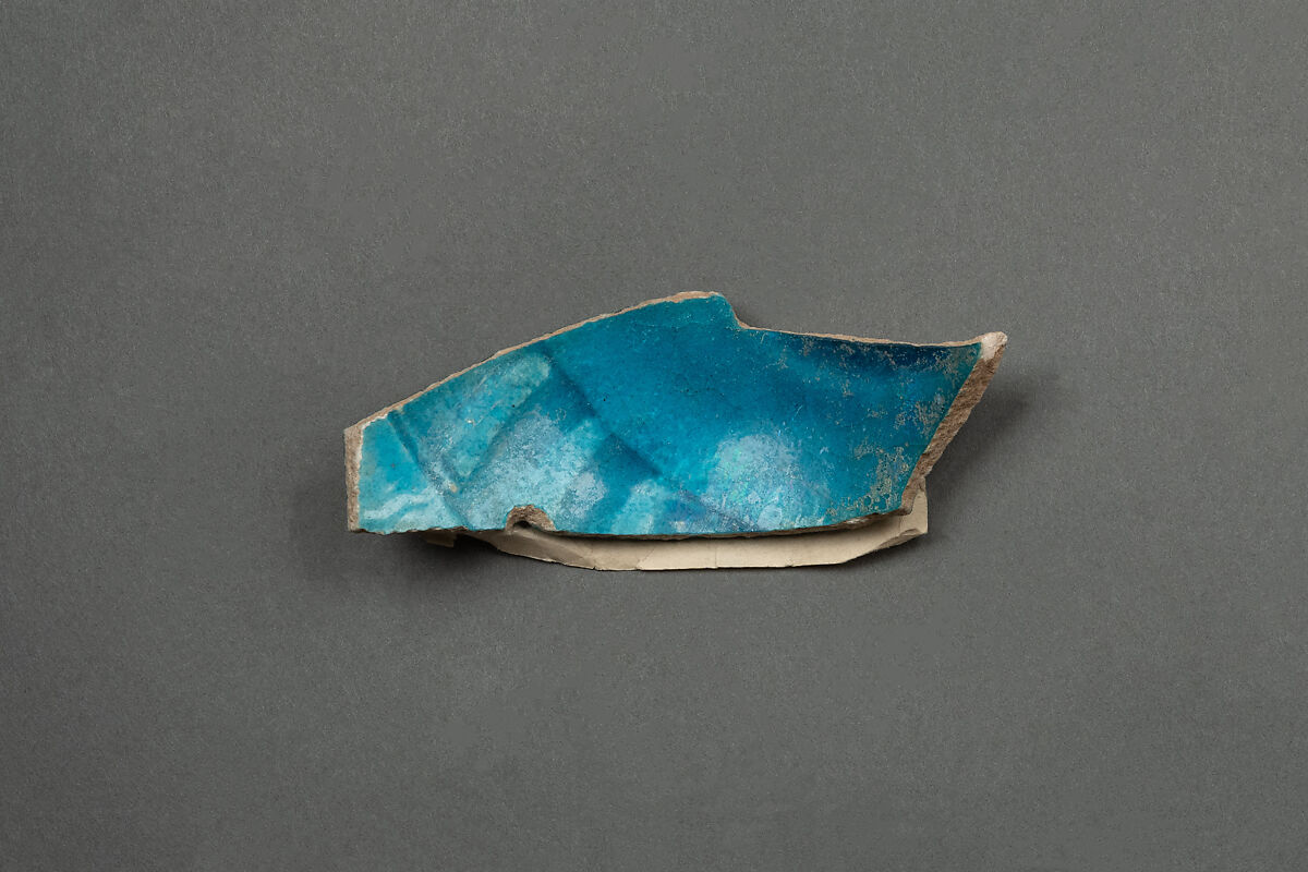 Fragment of a Bowl, Earthenware; gritty white body under blue and white glaze 