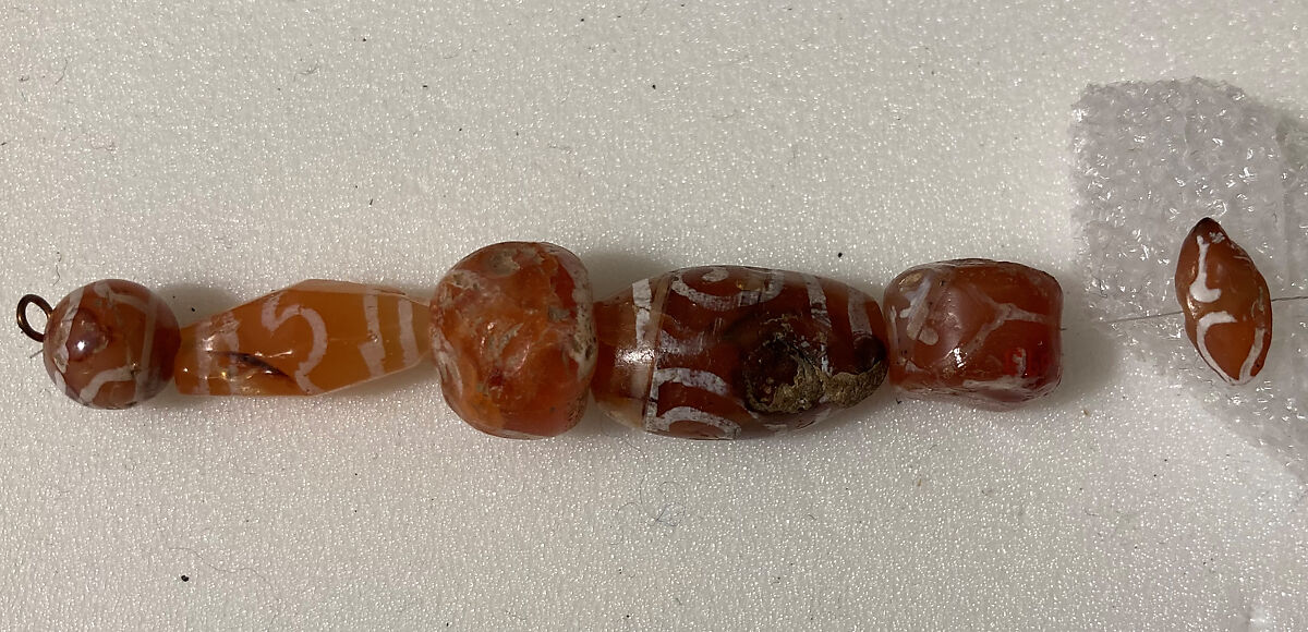 Beads, Carnelian; carved