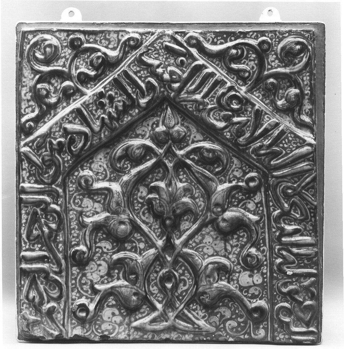 Tile with Niche Design and Inscription, Stonepaste; inglaze painted in blue, luster-painted on opaque white glaze, modeled decoration