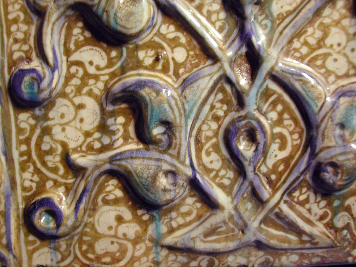 Tile with Niche Design and Inscription, Stonepaste; inglaze painted in blue, luster-painted on opaque white glaze, modeled decoration