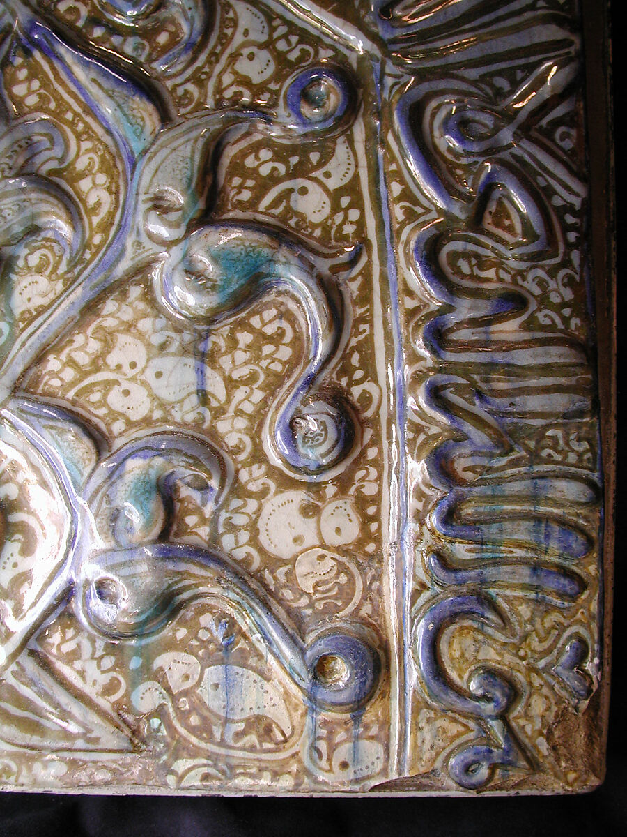 Tile with Niche Design and Inscription, Stonepaste; inglaze painted in blue, luster-painted on opaque white glaze, modeled decoration