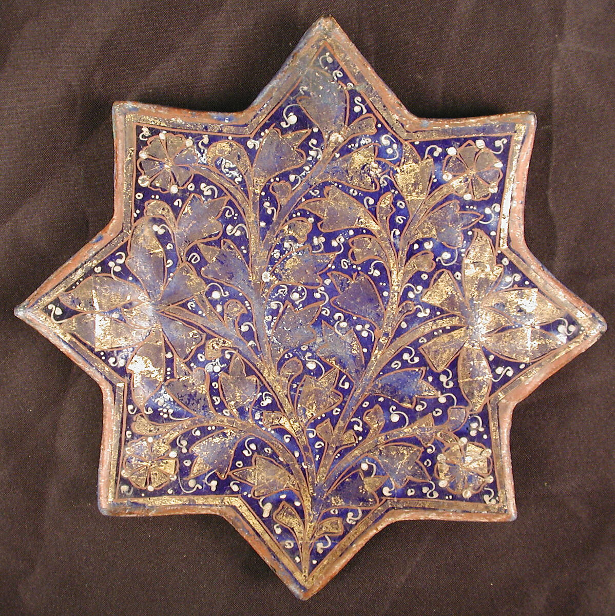 Star-Shaped Tile, Stonepaste; molded, overglaze painted and leaf gilded (lajvardina) 
