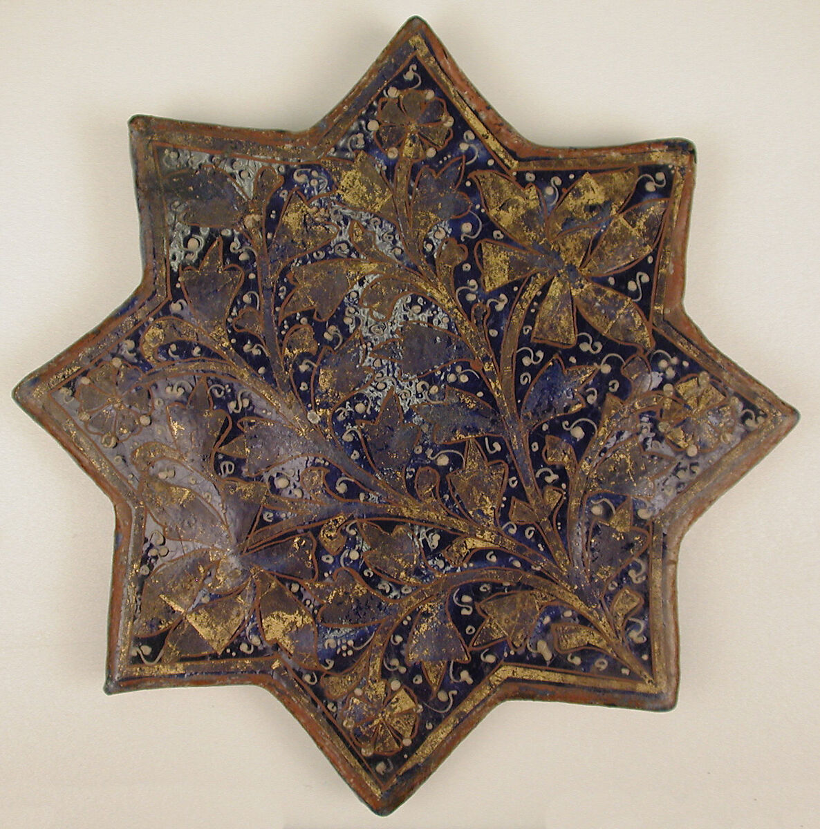Star-Shaped Tile, Stonepaste; molded, overglaze painted and leaf gilded (lajvardina)