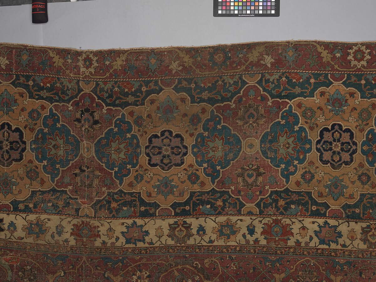 Carpet, Cotton (warp and weft), wool (pile); asymmetrically knotted pile 
