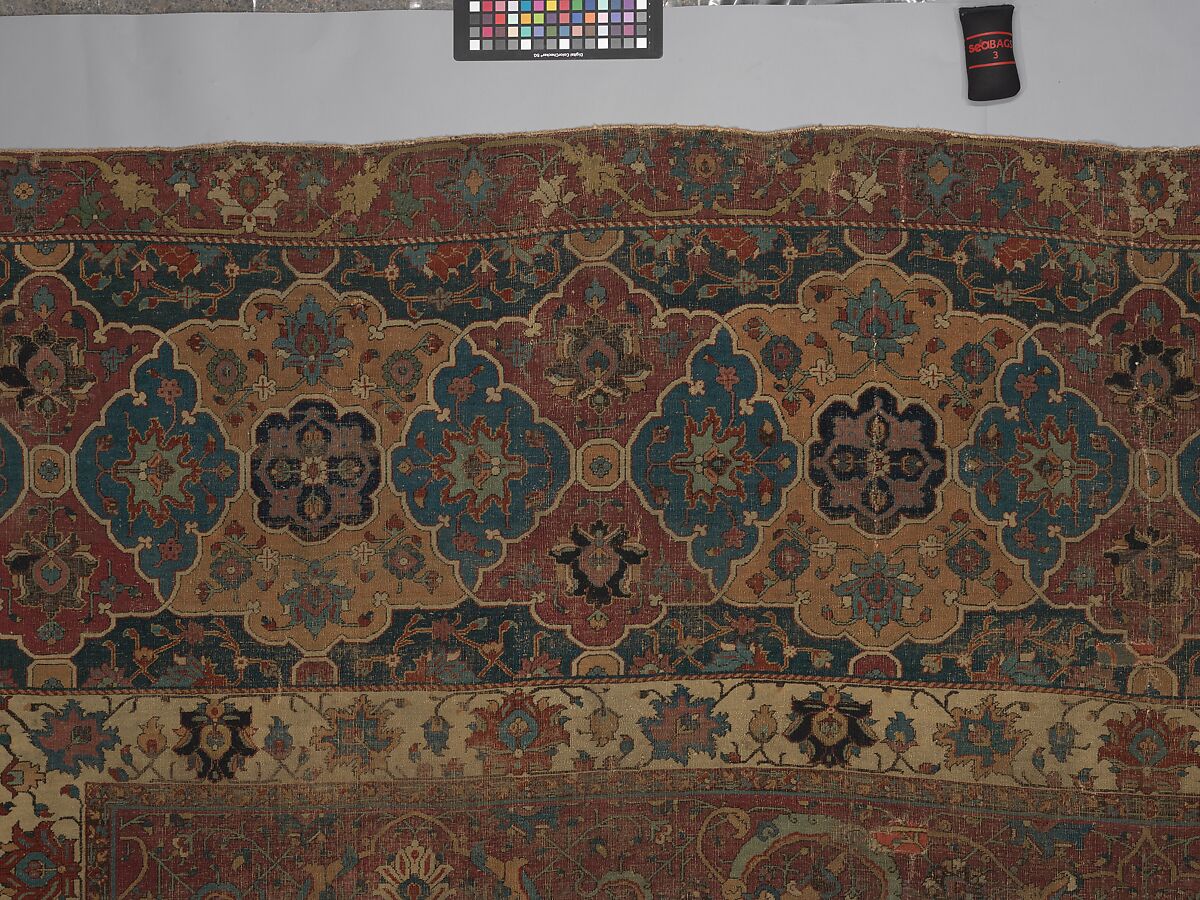 Carpet, Cotton (warp and weft), wool (pile); asymmetrically knotted pile 