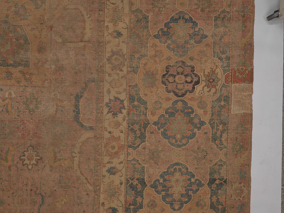 Carpet, Cotton (warp and weft), wool (pile); asymmetrically knotted pile 