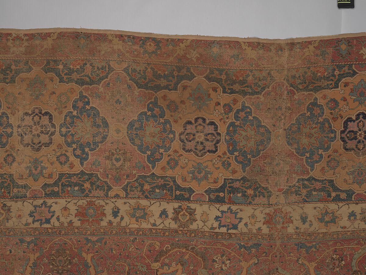 Carpet, Cotton (warp and weft), wool (pile); asymmetrically knotted pile 