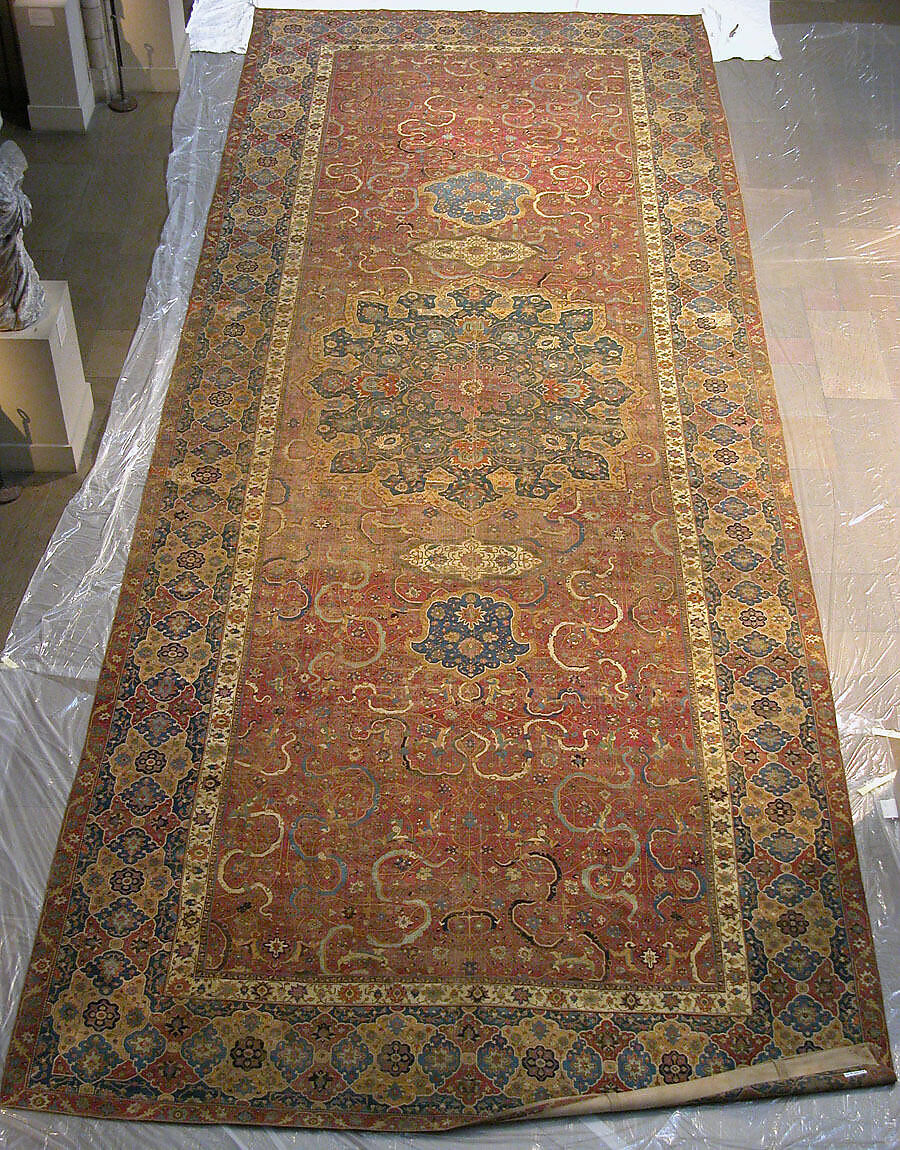 Carpet, Cotton (warp and weft), wool (pile); asymmetrically knotted pile 