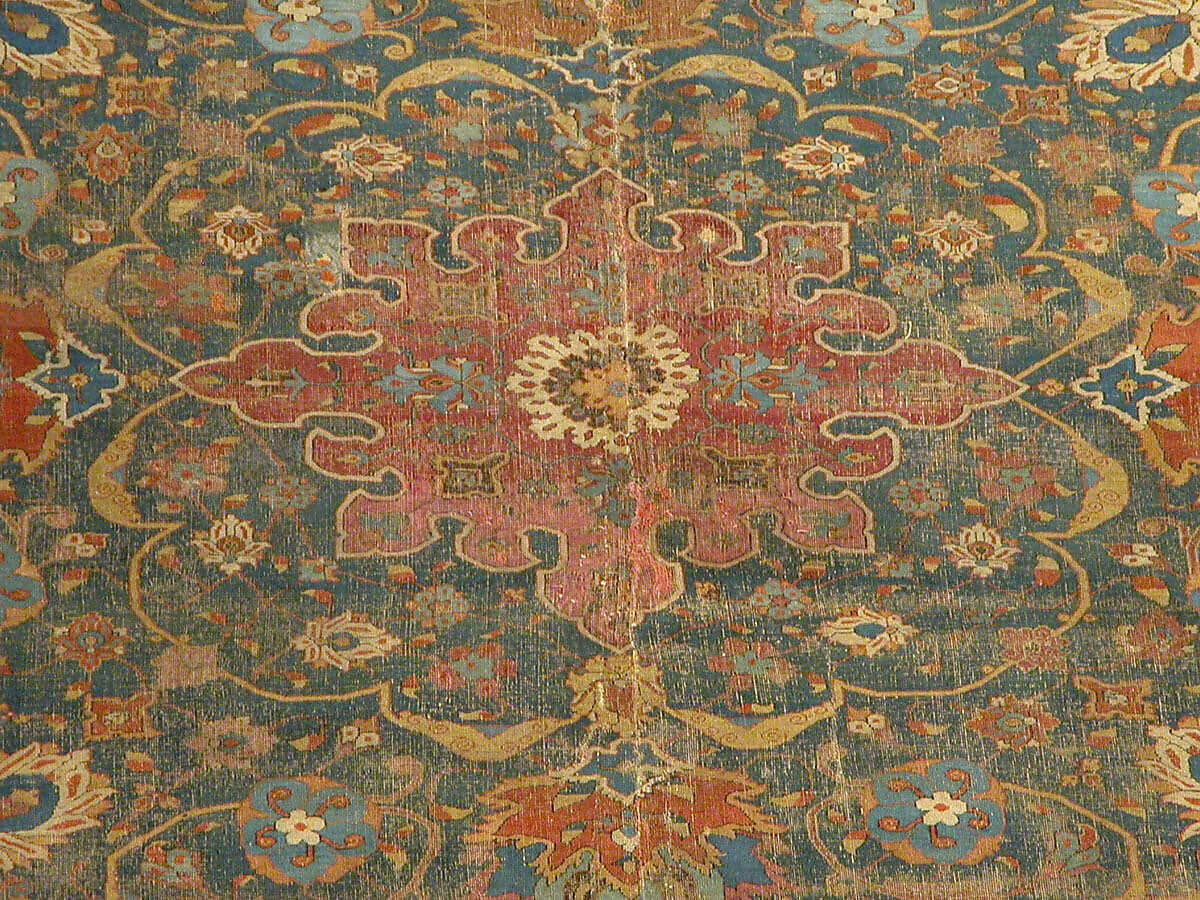 Carpet, Cotton (warp and weft), wool (pile); asymmetrically knotted pile 
