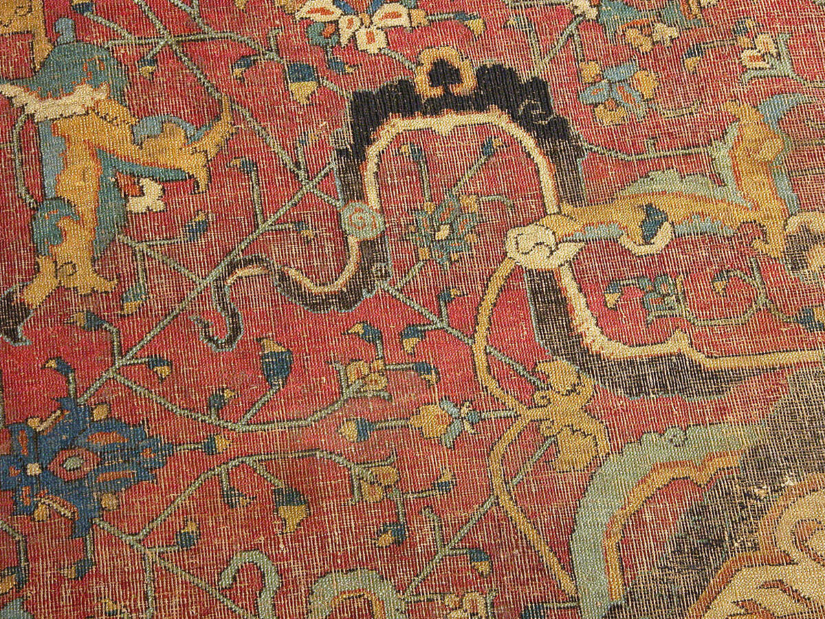 Carpet, Cotton (warp and weft), wool (pile); asymmetrically knotted pile 
