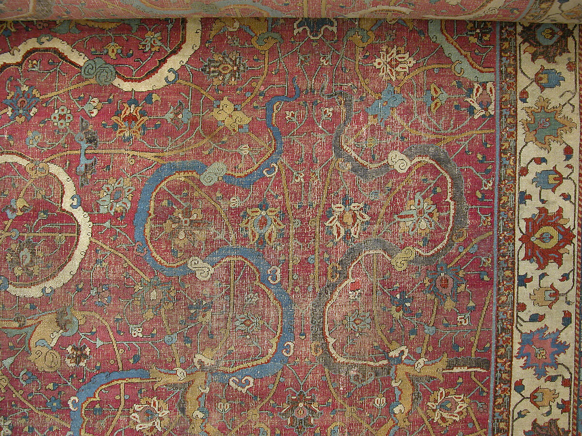 Carpet, Cotton (warp and weft), wool (pile); asymmetrically knotted pile 