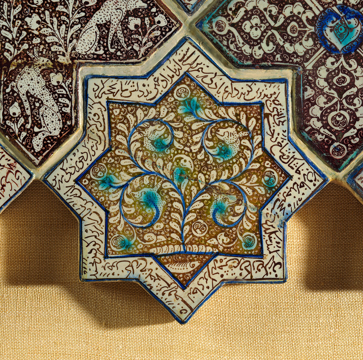 Star-Shaped Tile, Stonepaste; inglaze painted in blue and turquoise and luster-painted on opaque white glaze