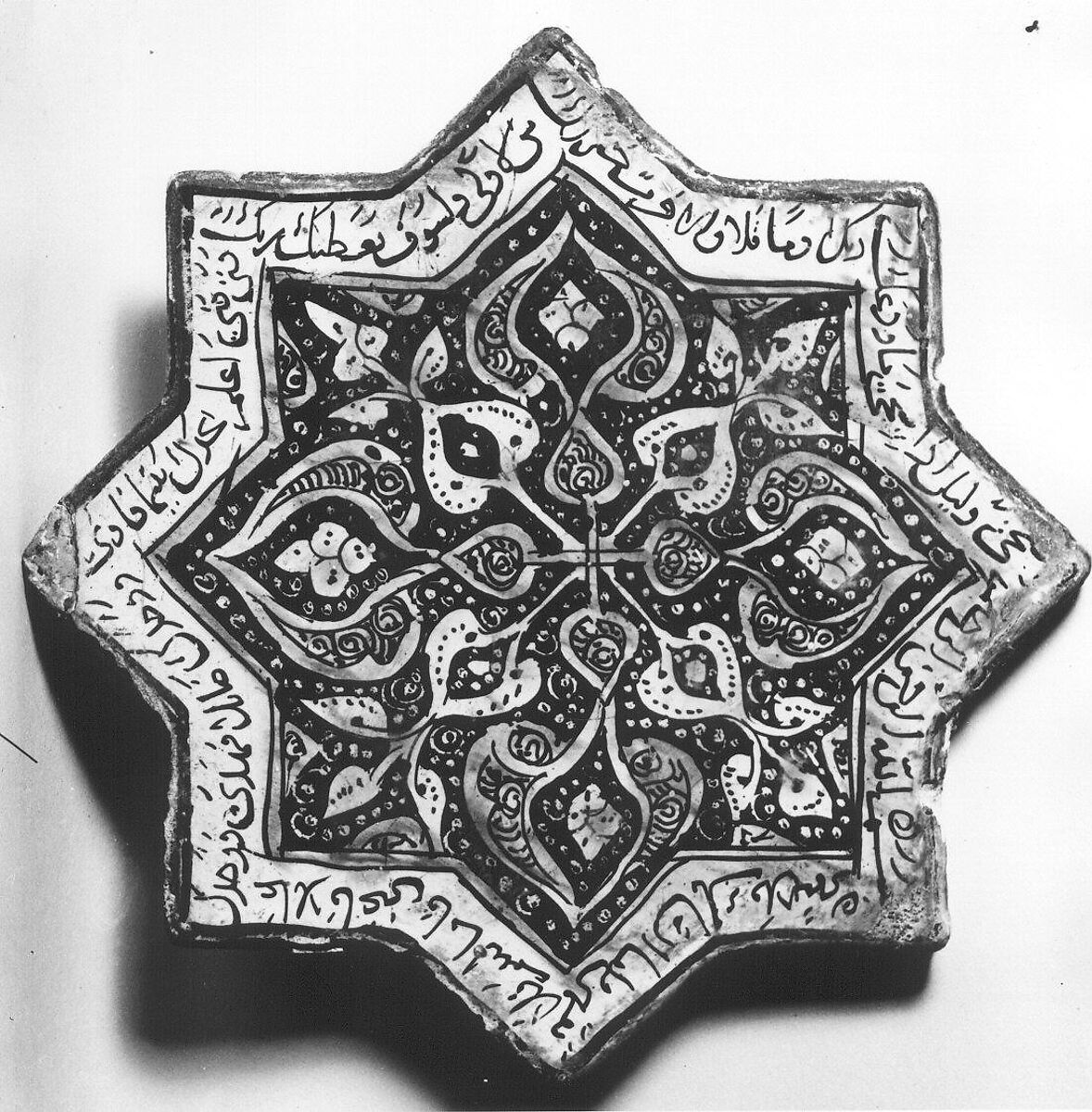 Star-Shaped Tile, Stonepaste; inglaze painted in blue and turquoise and luster-painted on opaque white glaze