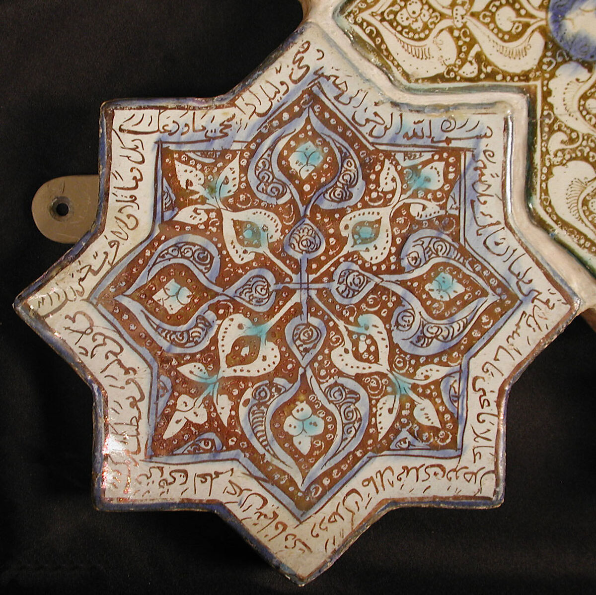 Star-Shaped Tile, Stonepaste; inglaze painted in blue and turquoise and luster-painted on opaque white glaze 