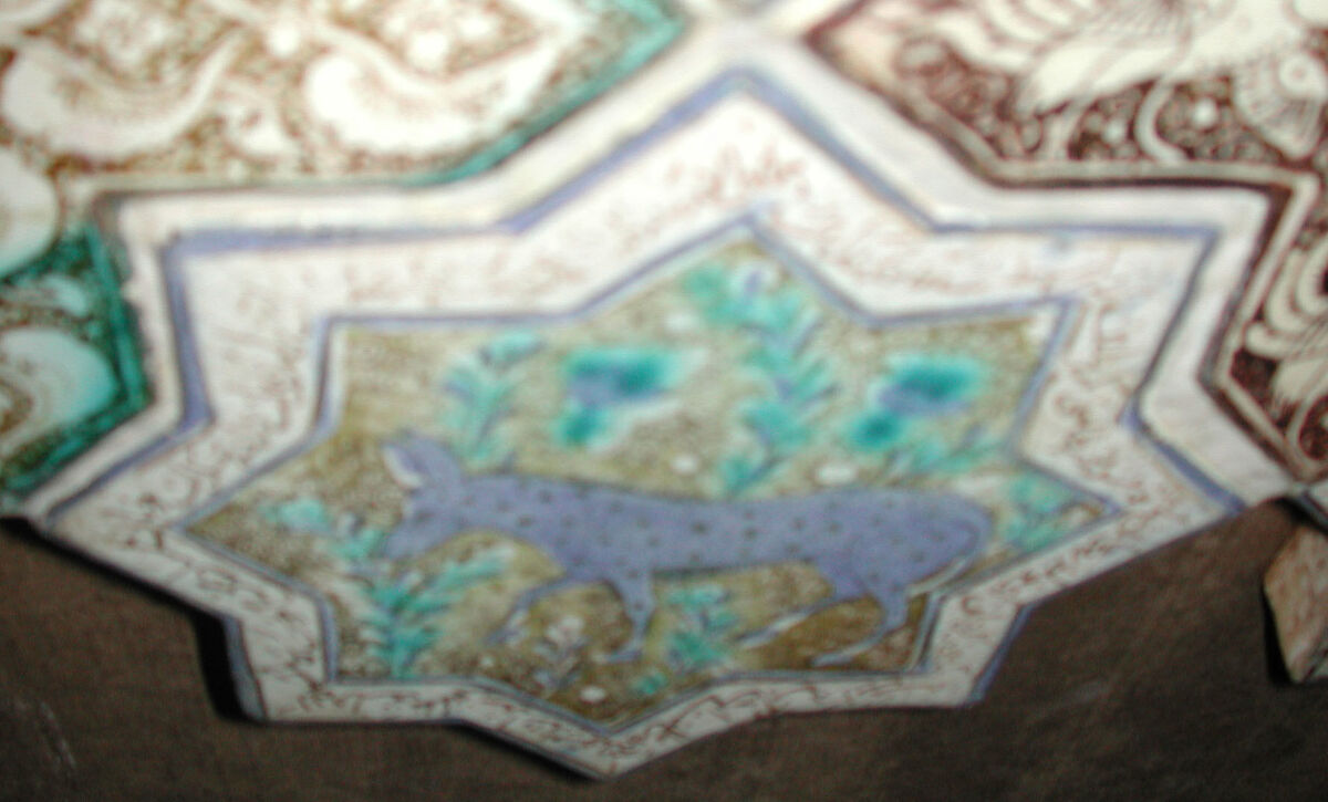 Star-Shaped Tile, Stonepaste; inglaze painted in blue and turquoise and luster-painted on opaque white glaze
