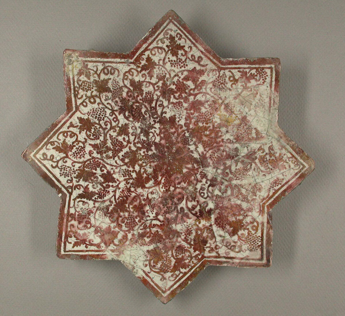 Star-Shaped Tile, Earthenware; luster-painted on opaque white glaze