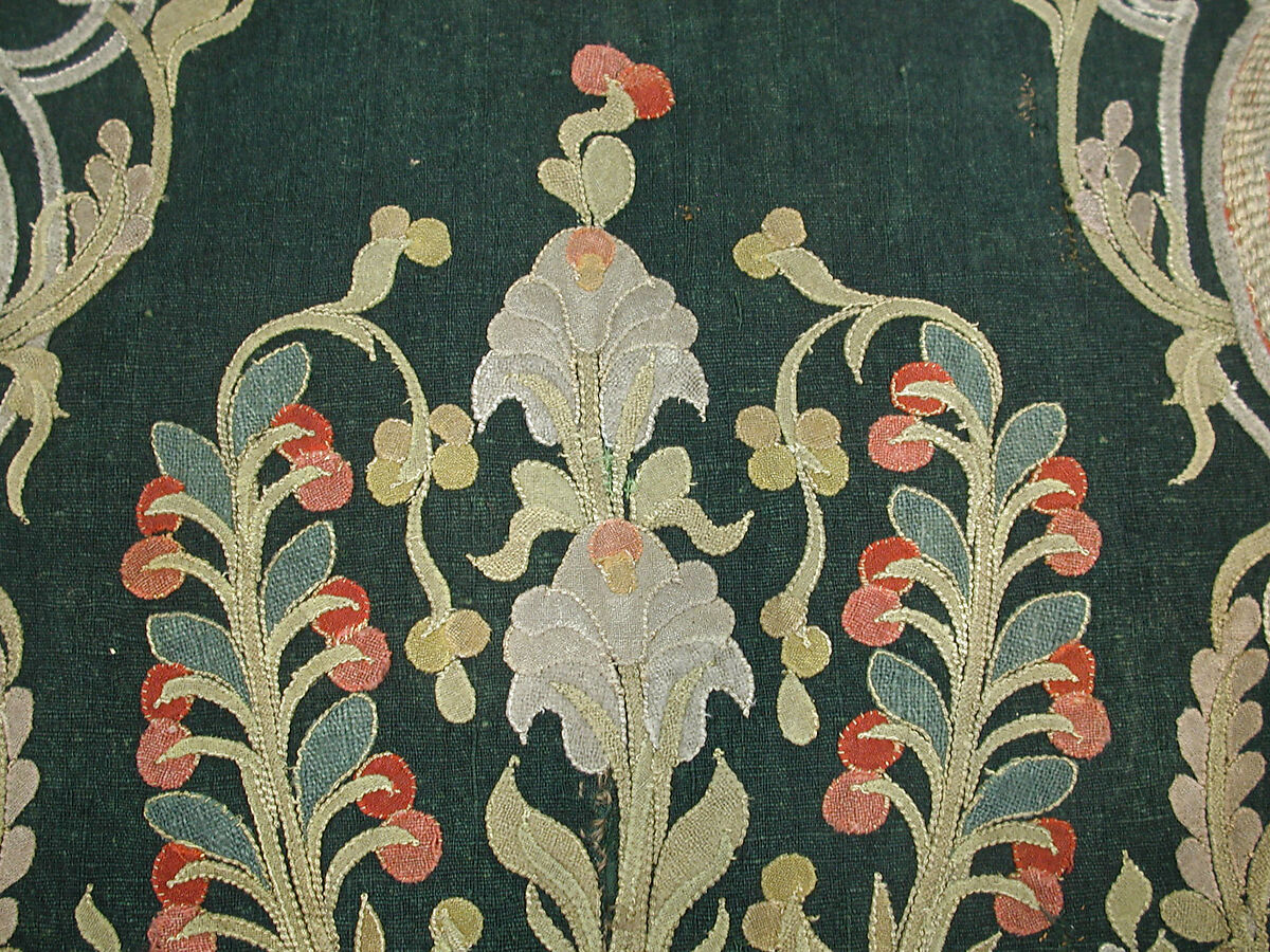 Hanging, Wool; design in wool applique outlined in silk, broken scrolls in silver thread couched in brickwork pattern; lining of brown satin.