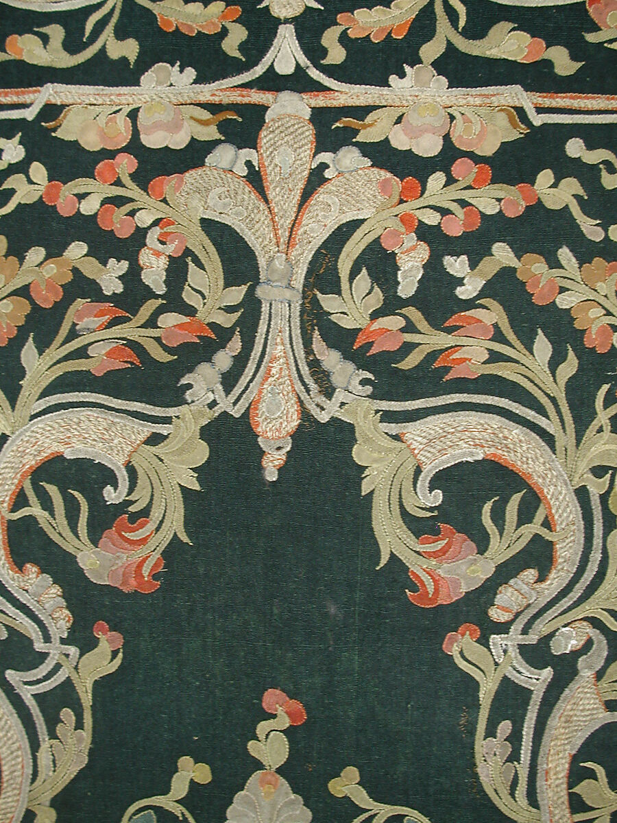 Hanging, Wool; design in wool applique outlined in silk, broken scrolls in silver thread couched in brickwork pattern; lining of brown satin.