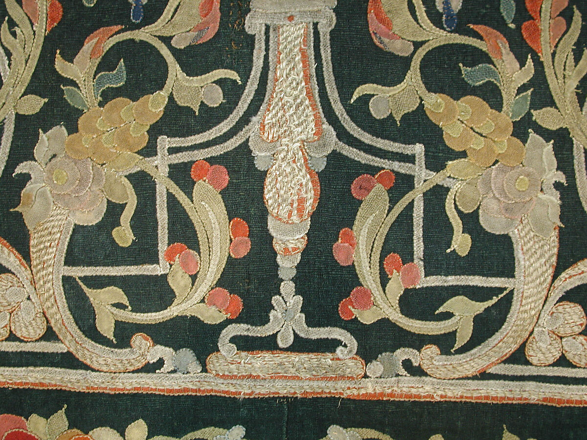 Hanging, Wool; design in wool applique outlined in silk, broken scrolls in silver thread couched in brickwork pattern; lining of brown satin.
