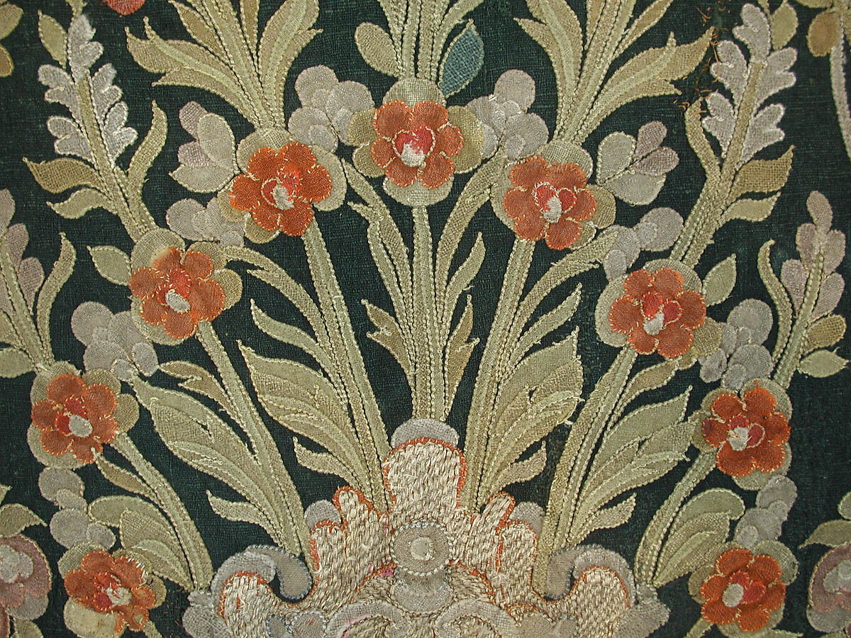 Hanging, Wool; design in wool applique outlined in silk, broken scrolls in silver thread couched in brickwork pattern; lining of brown satin.