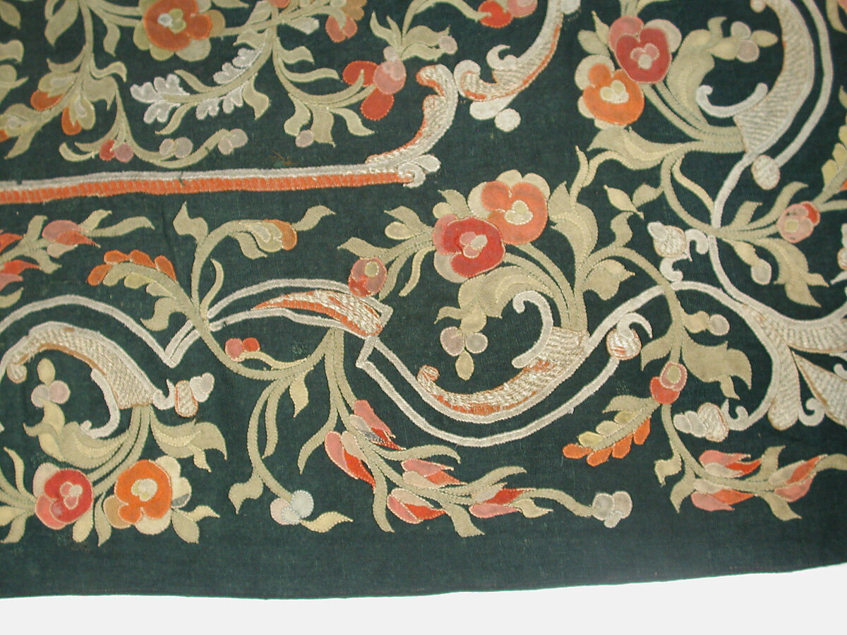 Hanging, Wool; design in wool applique outlined in silk, broken scrolls in silver thread couched in brickwork pattern; lining of brown satin.