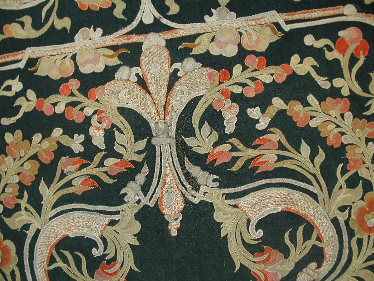 Hanging, Wool; design in wool applique outlined in silk, broken scrolls in silver thread couched in brickwork pattern; lining of brown satin.
