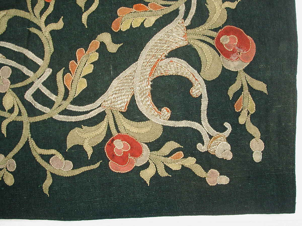 Hanging, Wool; design in wool applique outlined in silk, broken scrolls in silver thread couched in brickwork pattern; lining of brown satin.