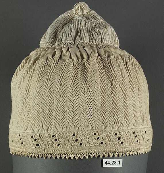 Cap, Cotton; quilted diagonally, border of punch work embroidery edged with crocheted cotton lace 