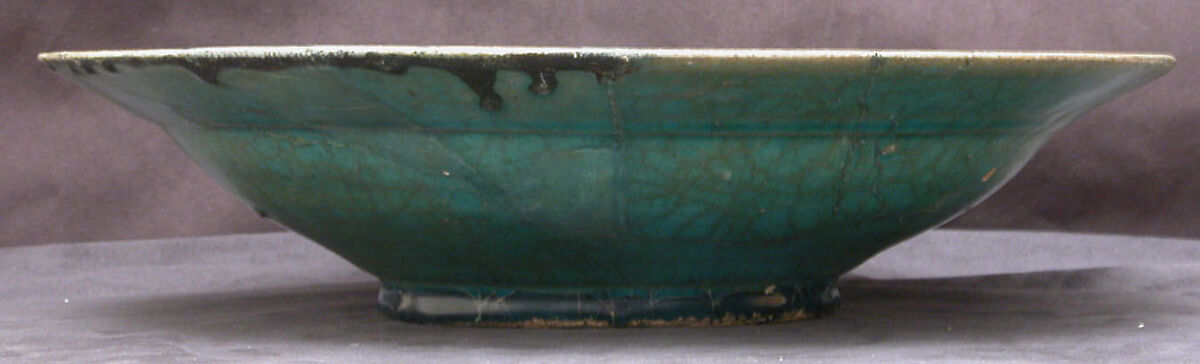 Dish with Horse and Rider, Stonepaste; incised decoration through a black slip ground under a turquoise glaze (silhouette ware)