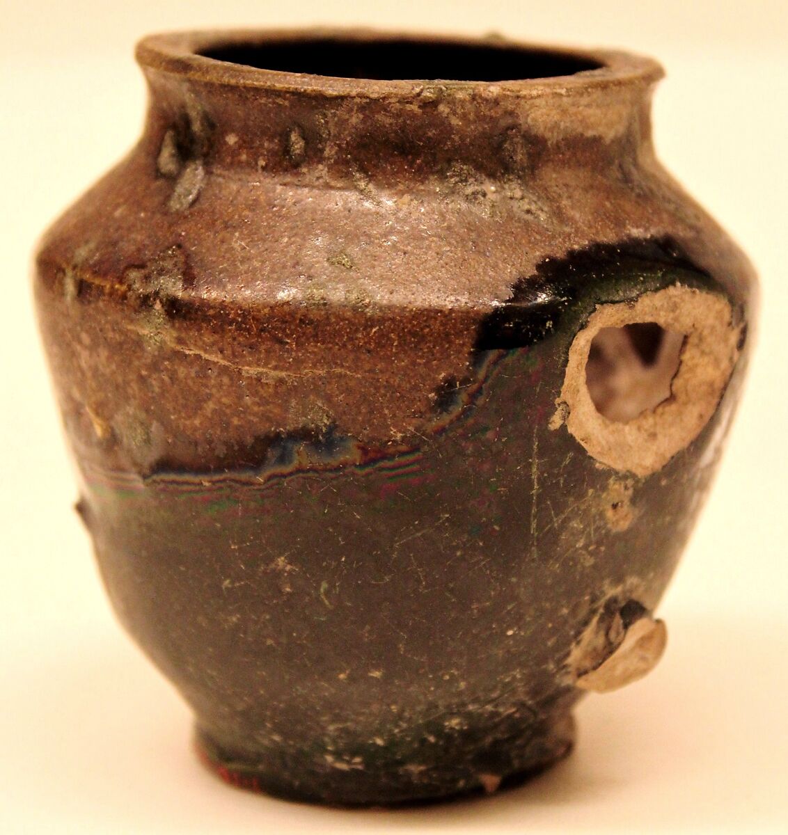 Jar, Earthenware; painted in white under green and brown glaze 