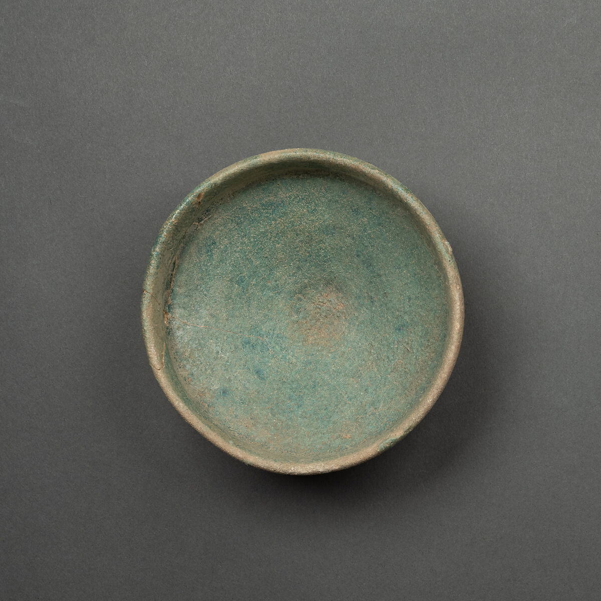 Dish, Earthenware; buff body under blue glaze, probably alkaline 