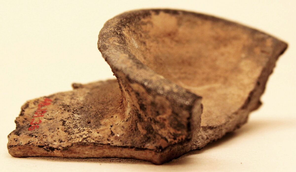 Fragment of a Misfired Vessel Base (Waster?), Stonepaste; charcoal body under olive-green and transparent glaze 