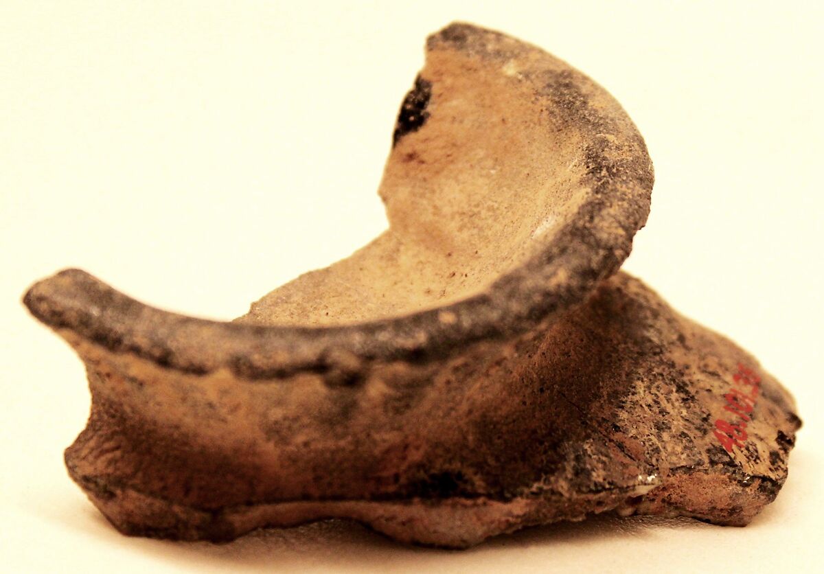 Fragment of a Misfired Vessel Base (Waster?), Stonepaste; charcoal body under olive-green and transparent glaze