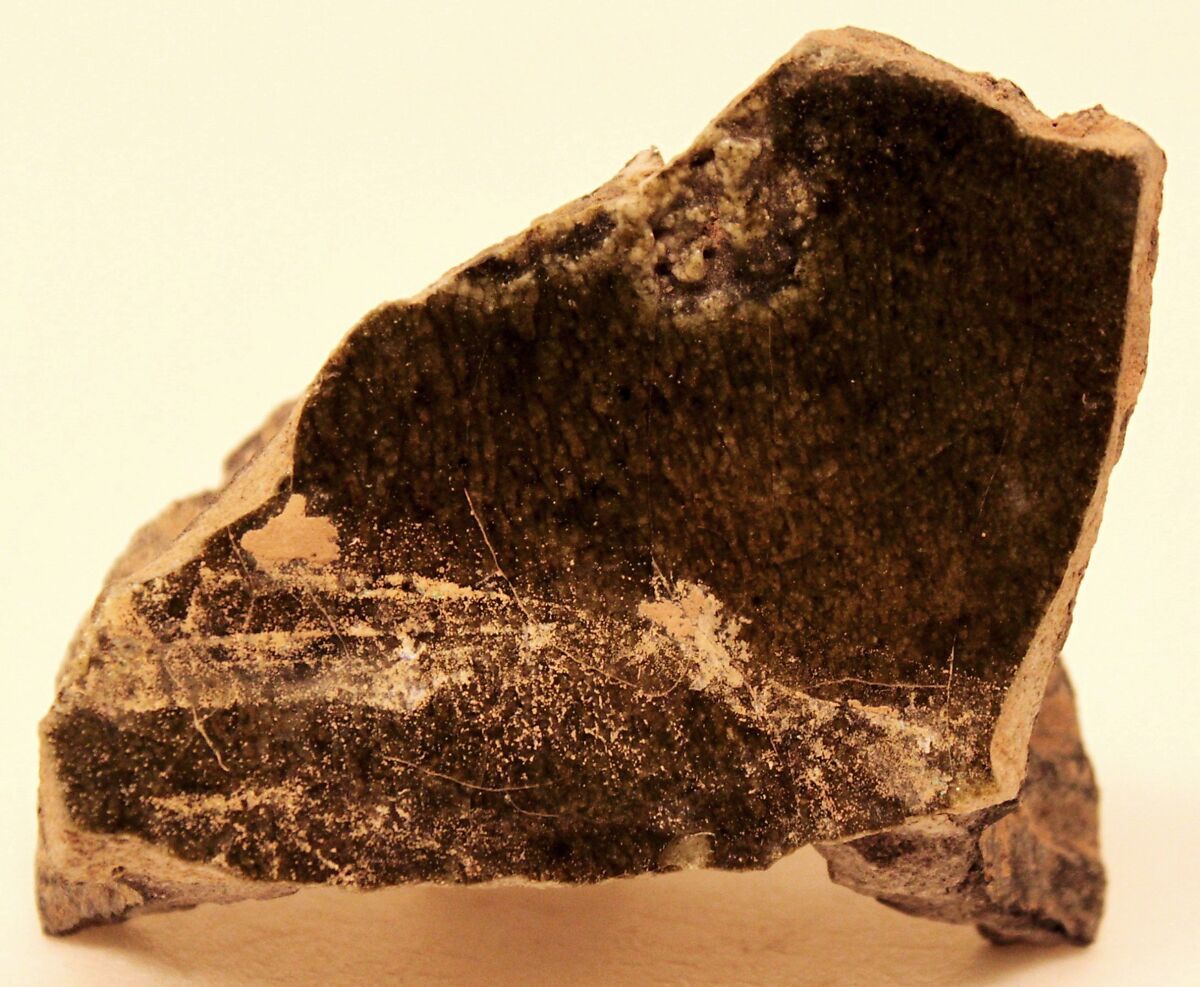 Fragment of a Misfired Vessel Base (Waster?), Stonepaste; charcoal body under olive-green and transparent glaze