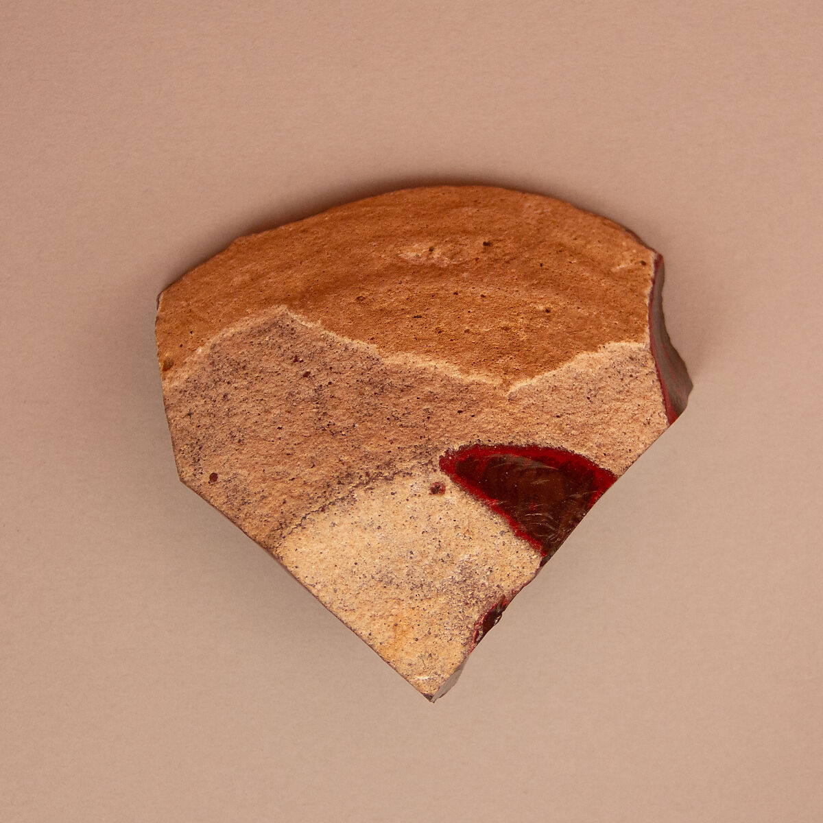 Glaze Clump, Alkaline glaze reverted to original state, forming solid re-hardened mass of liver color with bright red streaks