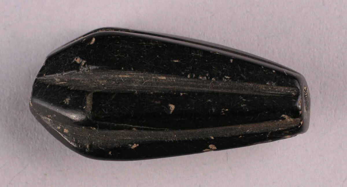 Bead, Black stone, probably jet; cut and drilled 