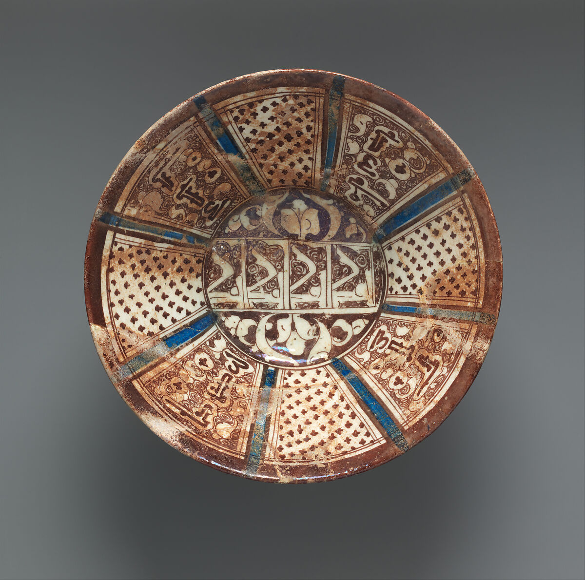 Ceramic Bowl Inscribed with "'Izz" ("Glory"), Stonepaste; underglaze-painted, glazed (transparent colorless), luster-painted 