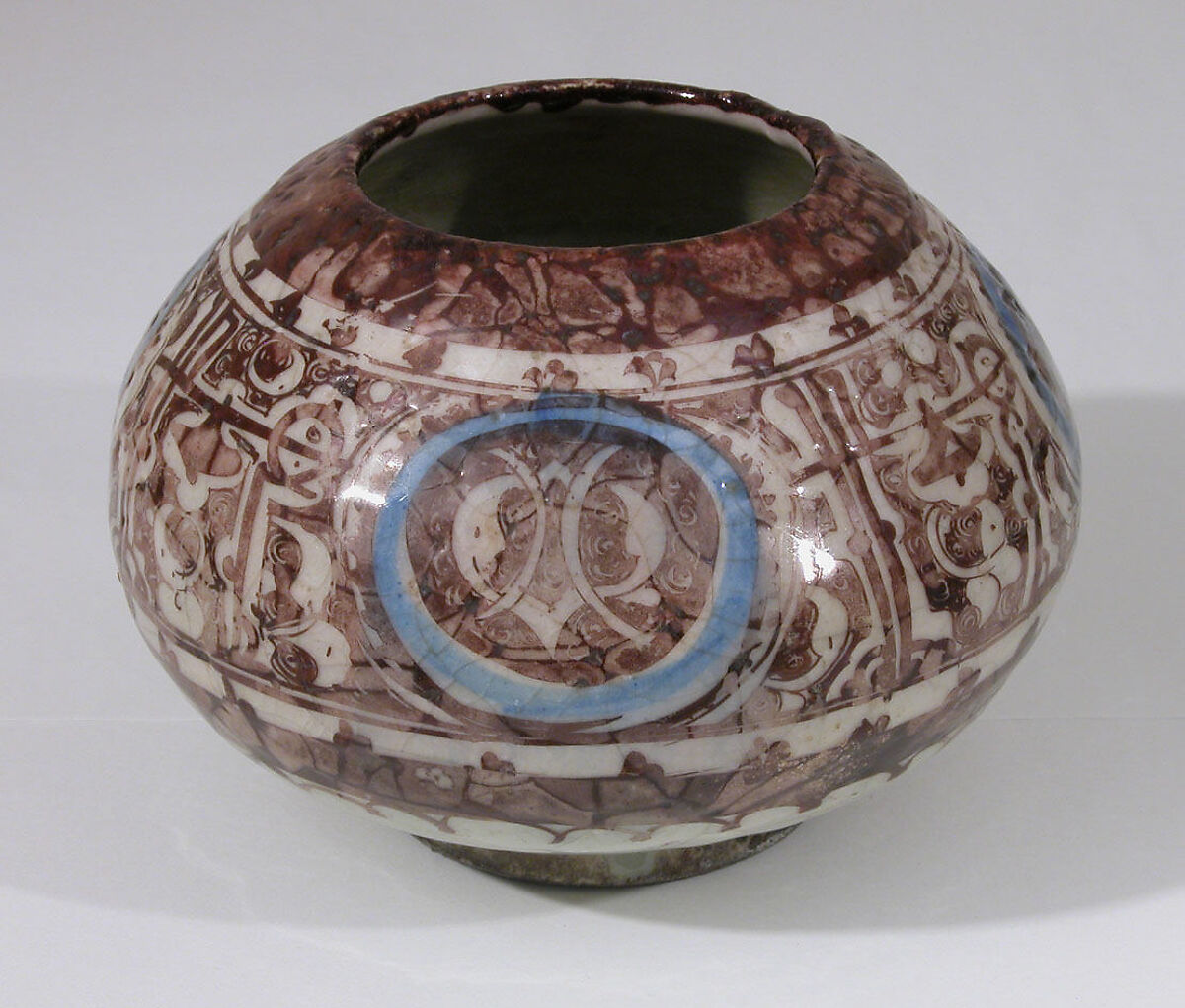 Bowl, Stonepaste; painted in luster and blue on opaque white glaze under transparent colorless glaze