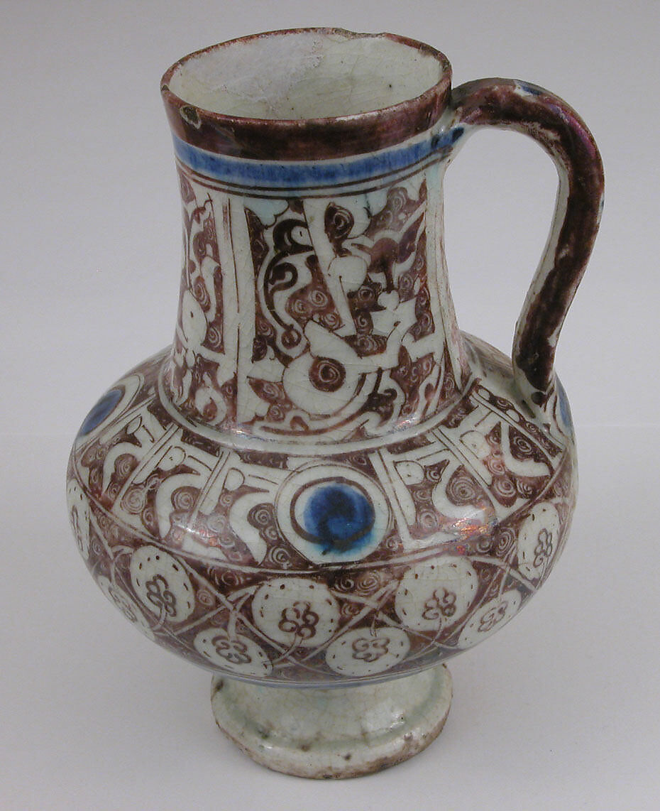 Ewer Inscribed with "al-'izz" ("Glory") in Floriated Kufic on its Neck, Stonepaste; painted in luster and blue on opaque white glaze under transparent glaze