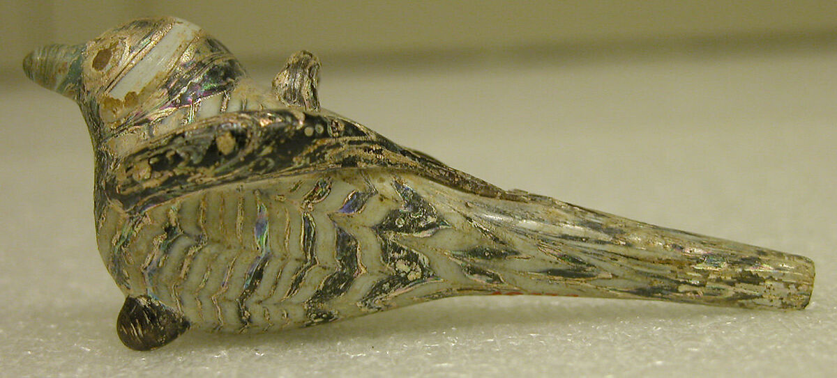 Bird-Shaped Pendant with Marvered Body, Glass, reddish-purple; blown, applied marvered opaque white decoration, applied reddish-purple, opaque turquise, and opaque red decoration