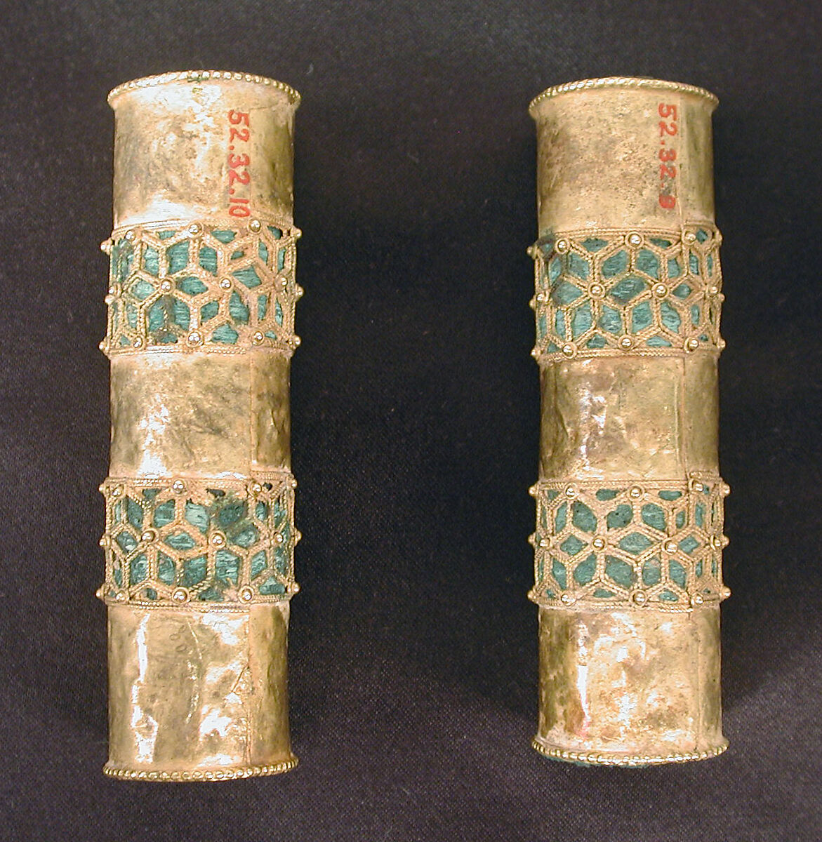 Hair Ornament, One of a Pair, Gold; cast, fabricated, engraved, with a copper alloy inner sleeve, decorated with twisted wire and granulation