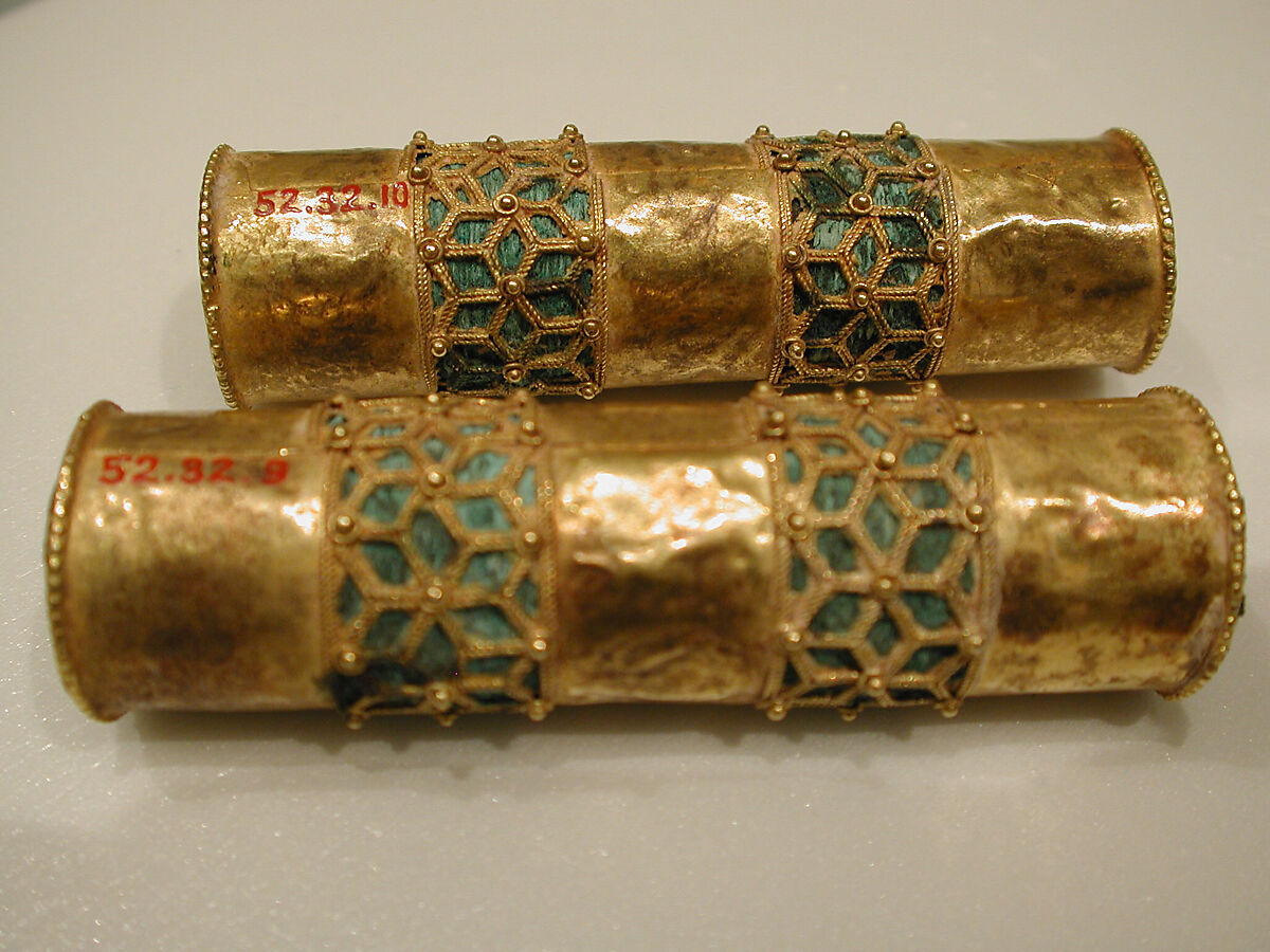 Hair Ornament, One of a Pair, Gold; cast, fabricated, engraved, with a copper alloy inner sleeve, decorated with twisted wire and granulation