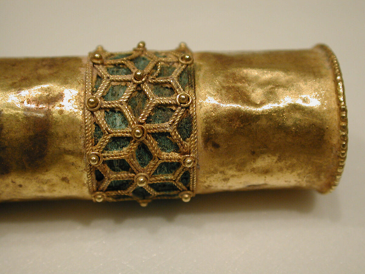 Hair Ornament, One of a Pair, Gold; cast, fabricated, engraved, with a copper alloy inner sleeve, decorated with twisted wire and granulation