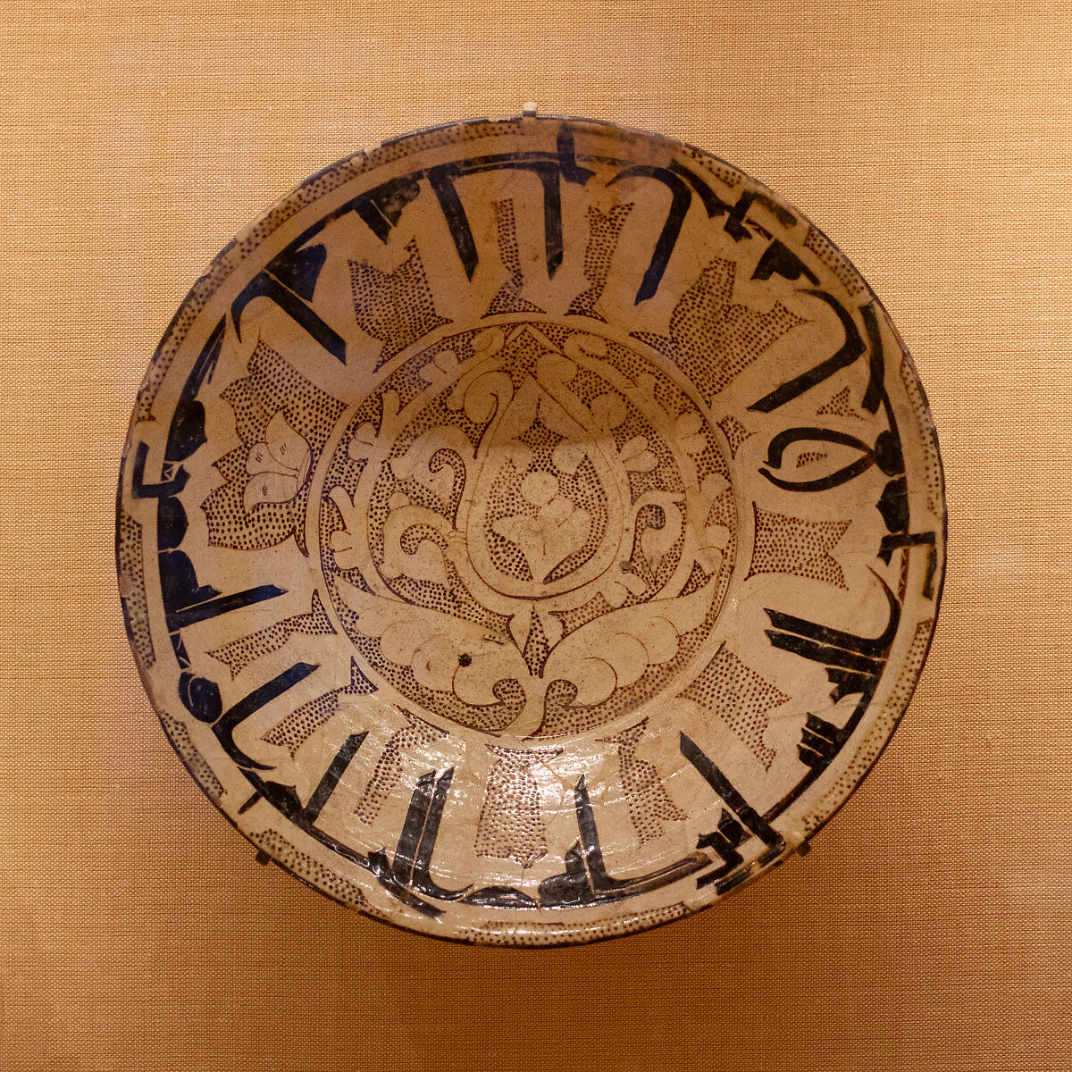 Bowl with Arabic Proverb, Earthenware; white slip with polychrome slip decoration under transparent glaze 