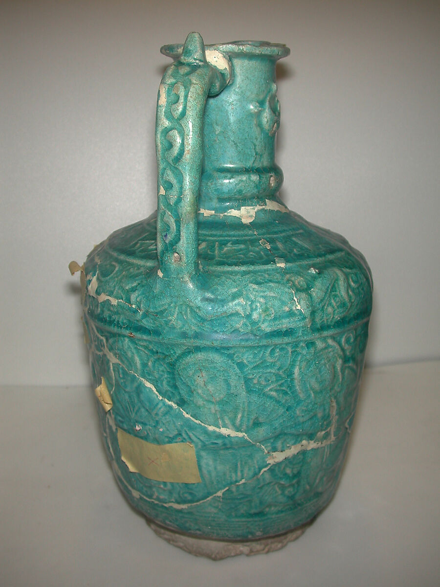 Ewer with Molded Inscriptions, Animals, and Dancers, Stonepaste; molded, monochrome glazed 