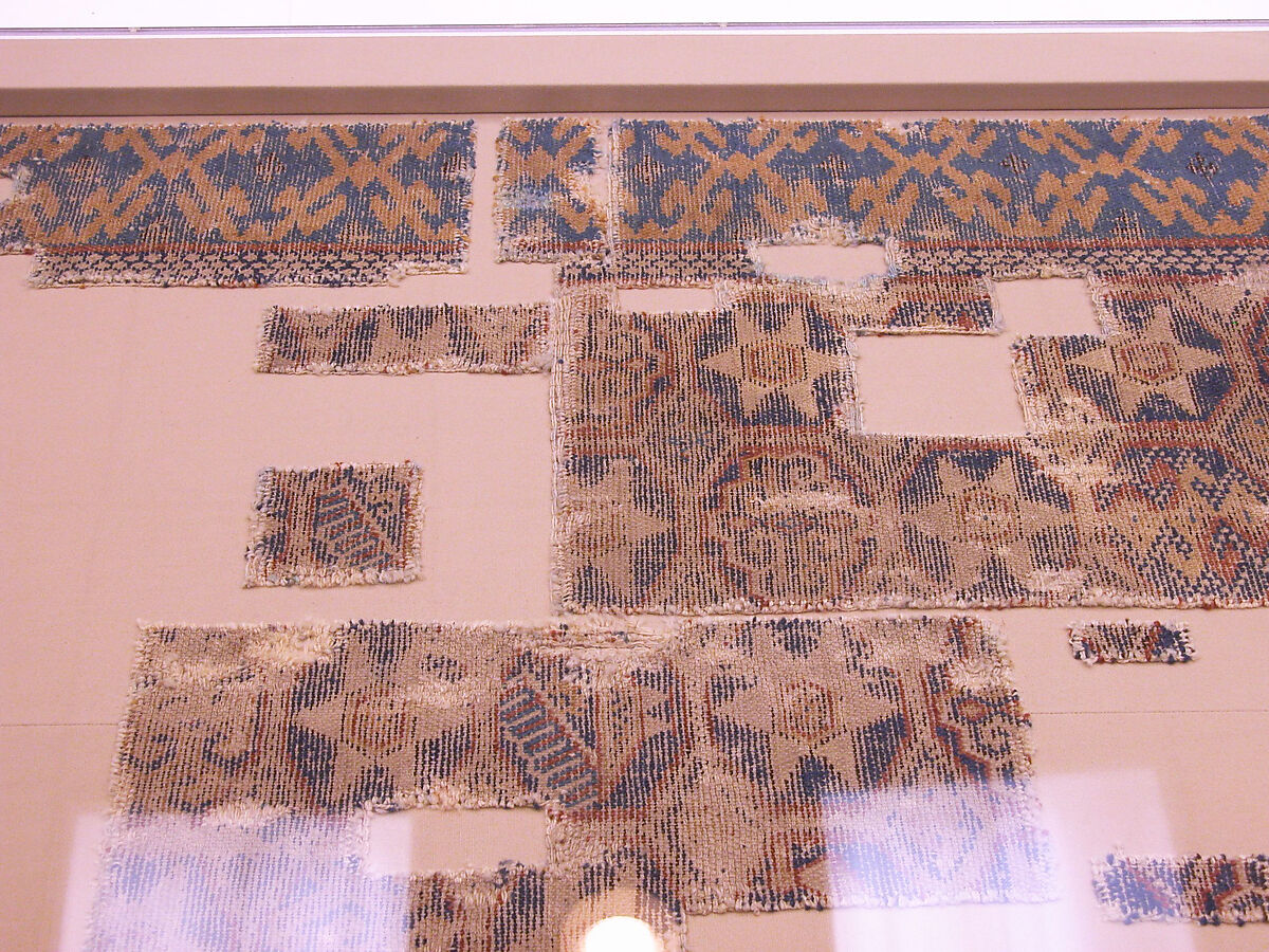 Joined Carpet Fragments, Wool (warp, weft and pile); single-warp (Spanish) knotted pile