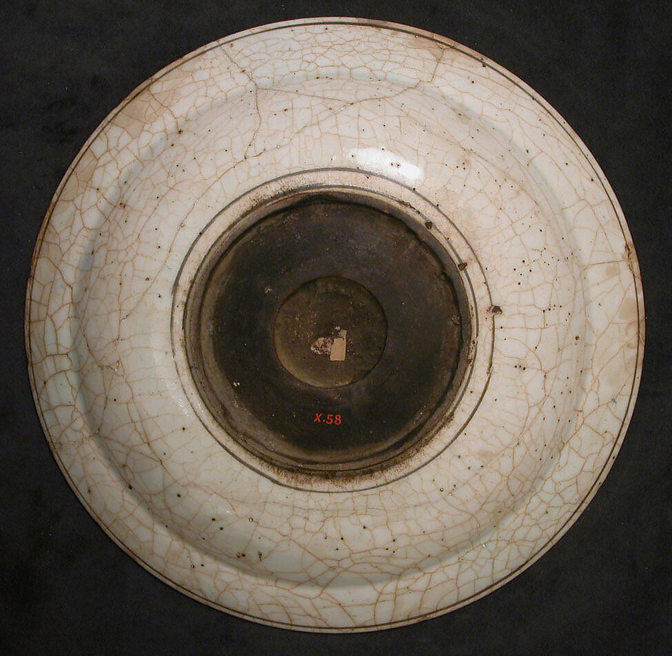 Dish, Stonepaste; underglaze painted in black, blue, and green with red and yellow slips