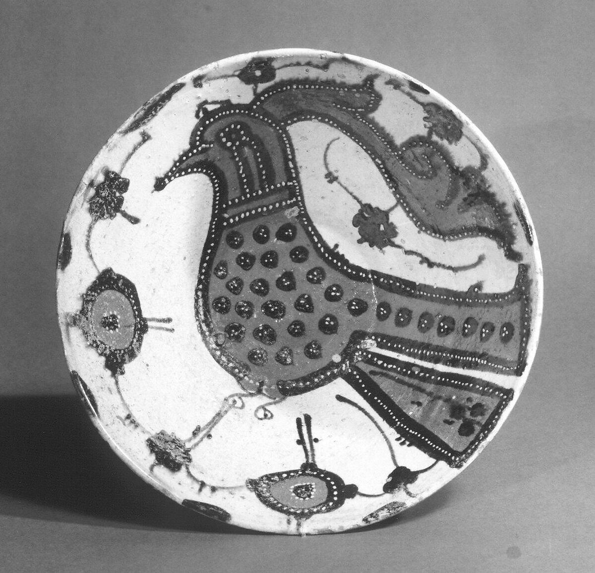Bowl with Bird and Flowers, Earthenware; white slip with polychrome slip decoration under transparent glaze (Sari ware)